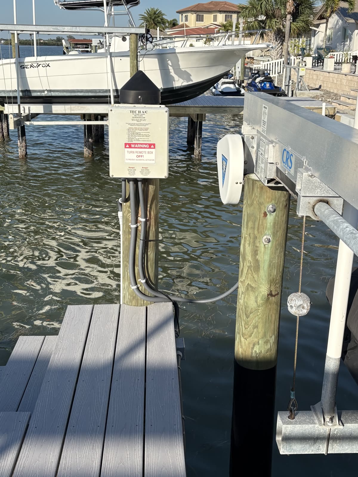 Boat lift control box and dock power wired by Brightwire Electric on a Tampa Bay canal