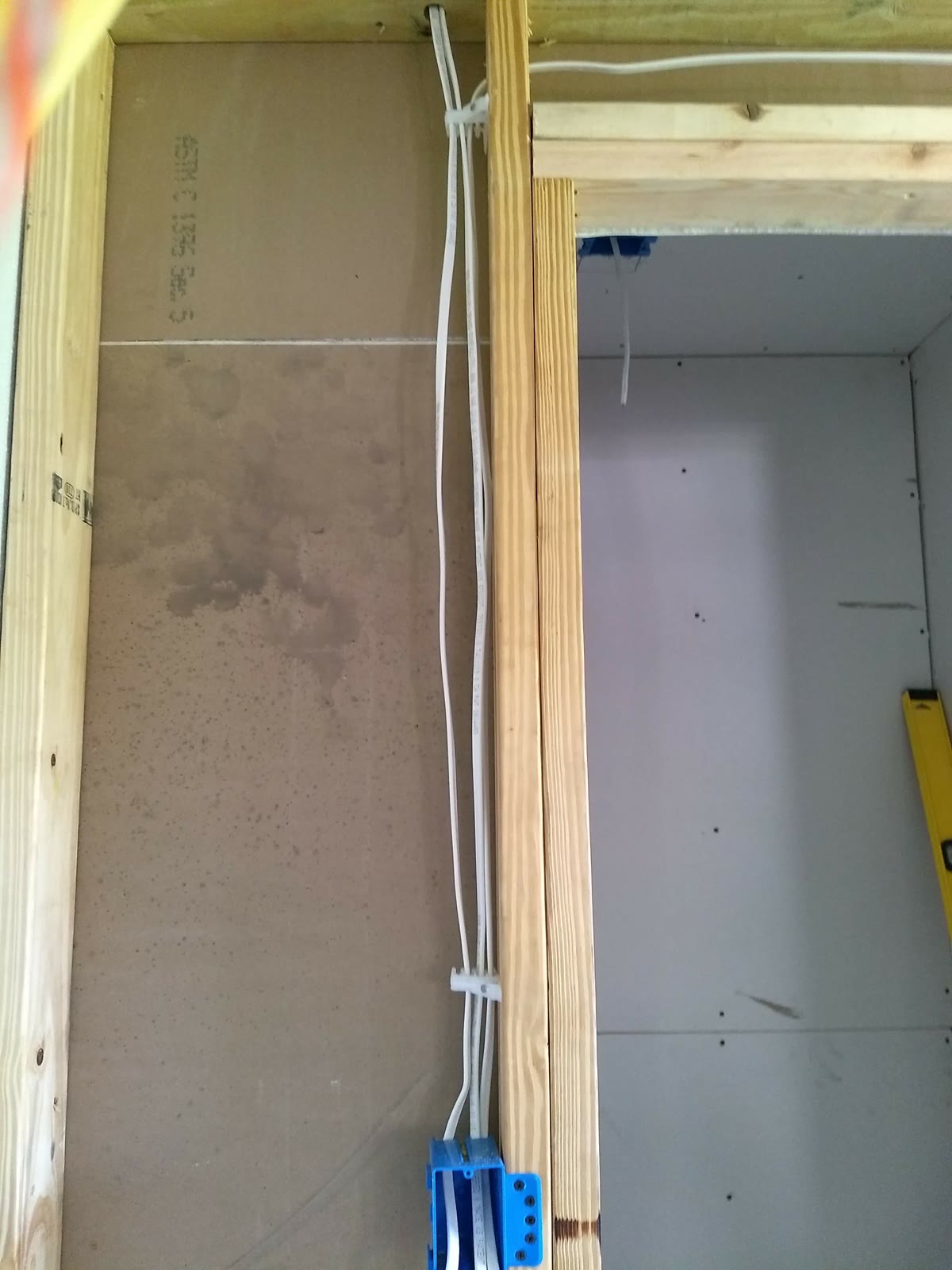 New rough-in wiring run cleanly through a framed wall during a rewire