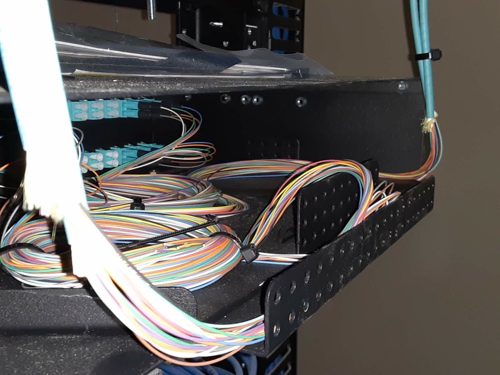 Fiber breakout and patch panel tray in a Tampa Bay hotel telecom room