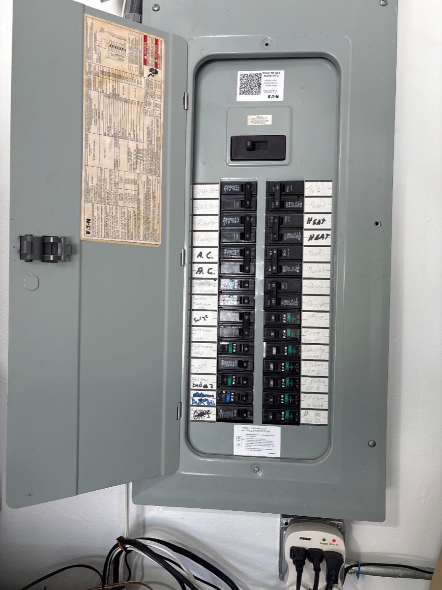Close-up of residential breaker panel with labeled breakers installed by Brightwire Electric