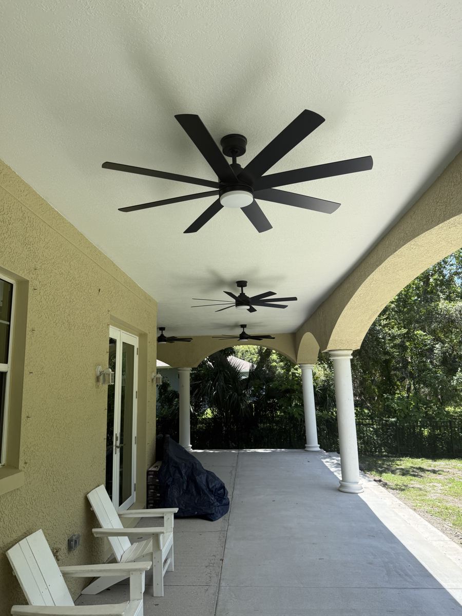 Covered lanai with new ceiling fans installed by Brightwire Electric