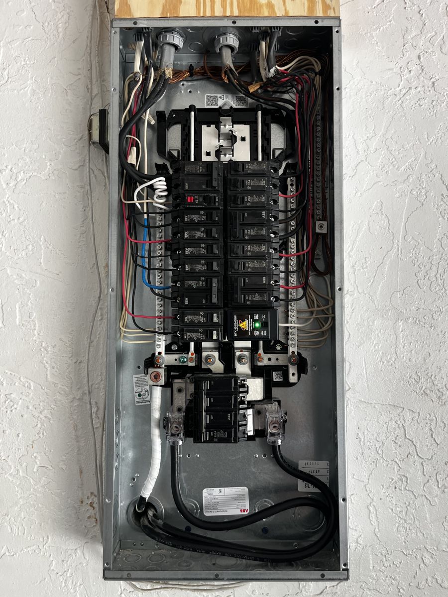 New breaker panel with neatly dressed wiring installed by Brightwire Electric