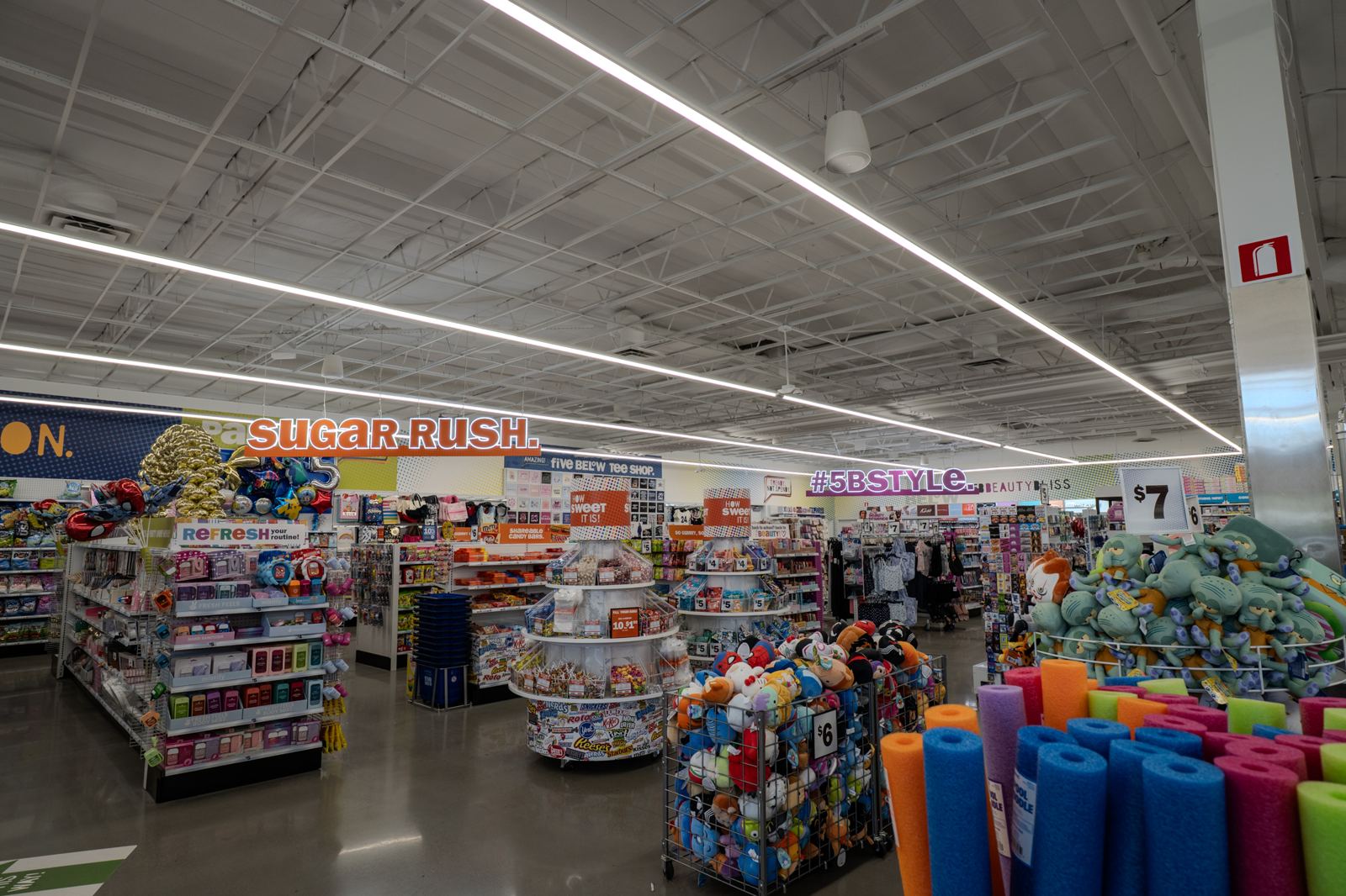 Retail store interior lit by long runs of linear LED fixtures, a Brightwire Electric project