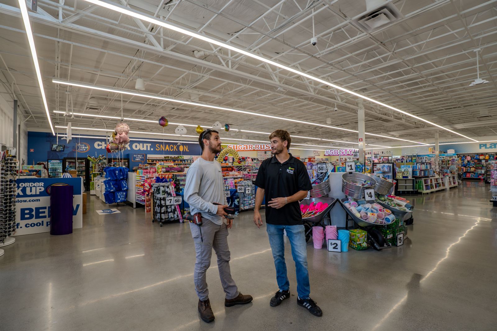 Brightwire Electric team walking a retail store project